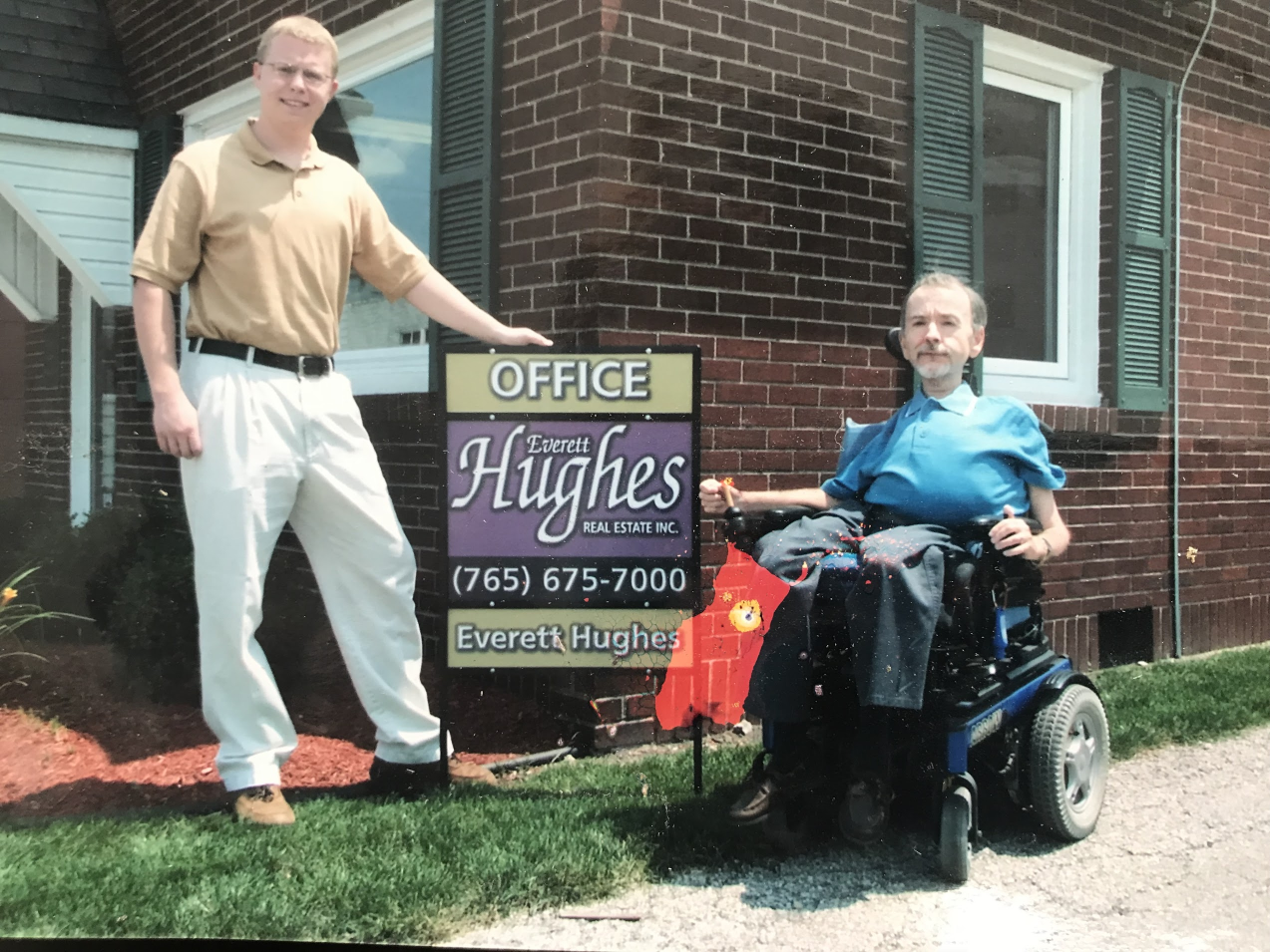 Benjamin Schoettmer standing beside Everett Hughes outside Everett Hughes Real Estate in Tipton, Indiana.