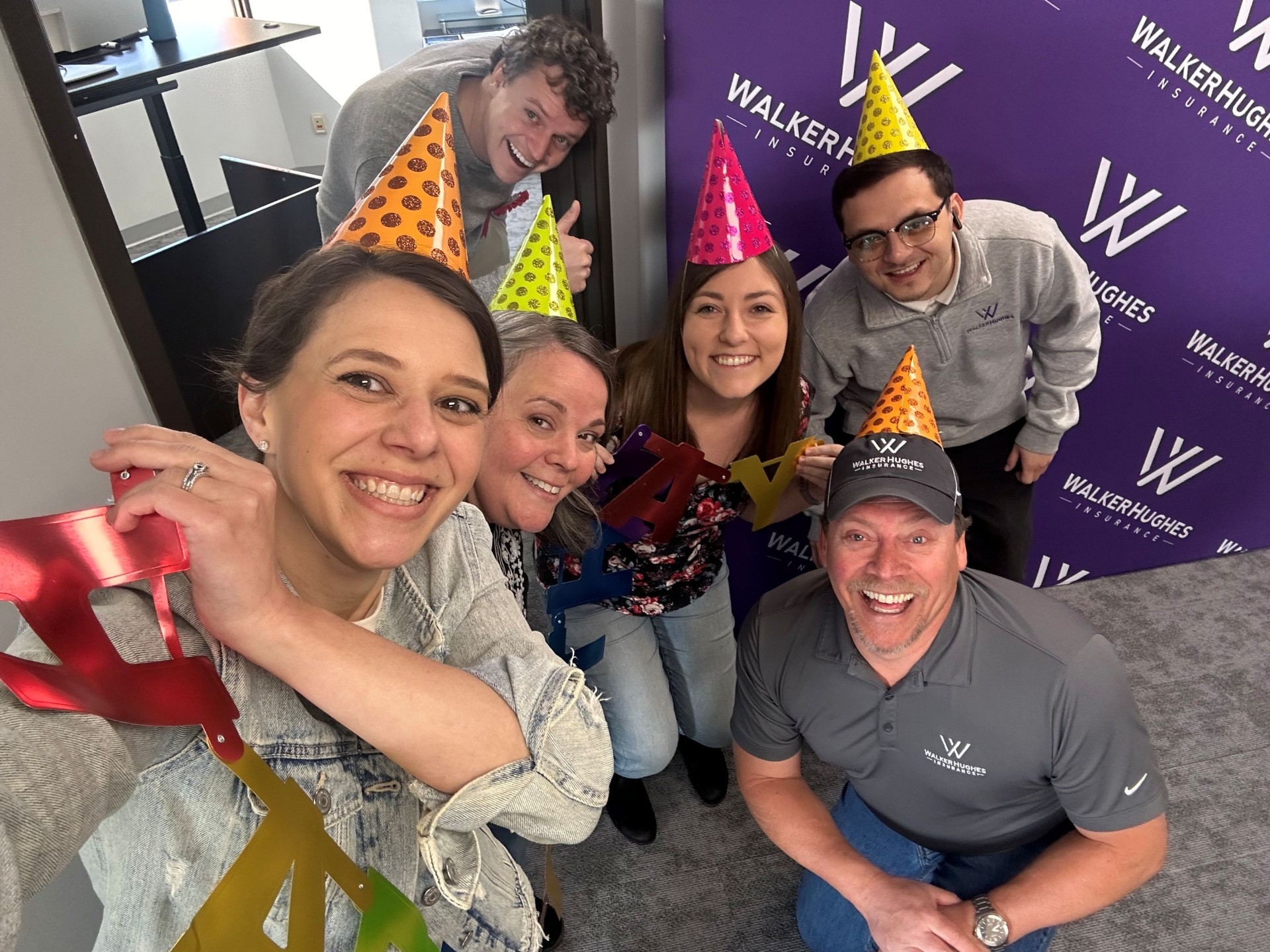 WalkerHughes team members celebrating together at the office.